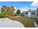 View of back yard with shed and concrete patio at 8256 Lark St, Seminole, FL 33777