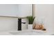 Close-up of stylish bathroom vanity with a modern matte black faucet at 8256 Lark St, Seminole, FL 33777