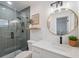 Beautifully renovated bathroom with glass enclosed shower and vanity at 8256 Lark St, Seminole, FL 33777