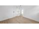 A clean bedroom with wood floor, white walls, and modern doors at 8256 Lark St, Seminole, FL 33777