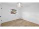 Light and airy bedroom with a ceiling fan and window to the yard at 8256 Lark St, Seminole, FL 33777
