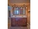 Bathroom featuring a double vanity with framed mirrors and ample storage space at 8759 Orient Ne Way, St Petersburg, FL 33702