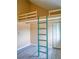 This bedroom includes a unique lofted sleeping area accessible by a ladder, maximizing space and adding character at 8759 Orient Ne Way, St Petersburg, FL 33702