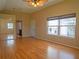 Large bedroom with mirrored closet doors, hardwood floors, and plenty of natural light at 8759 Orient Ne Way, St Petersburg, FL 33702