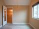A tidy bedroom showcasing modern flooring and a walk-in closet with installed shelving for organized storage solutions at 8759 Orient Ne Way, St Petersburg, FL 33702
