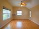 Spacious bedroom features vaulted ceilings, a ceiling fan, and hardwood floors at 8759 Orient Ne Way, St Petersburg, FL 33702