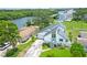 Beautiful two-story home featuring a modern design, lush landscaping, and ample parking at 8759 Orient Ne Way, St Petersburg, FL 33702