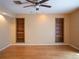 Open living room featuring hardwood floors and built-in shelving at 8759 Orient Ne Way, St Petersburg, FL 33702