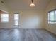 Open living area with sleek floors, and ample natural light from multiple windows at 8759 Orient Ne Way, St Petersburg, FL 33702