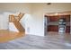 Open concept living area flows to kitchen; features modern appliances and staircase at 8759 Orient Ne Way, St Petersburg, FL 33702