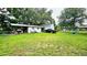 This large backyard has plenty of room for outdoor activities as well as an extra outbuilding for storage at 5623 Southernview Dr, Zephyrhills, FL 33541