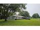 This single story home has a manicured lawn, large shade tree, attached one car garage, and neutral paint at 5623 Southernview Dr, Zephyrhills, FL 33541