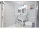 Clean bathroom featuring a single vanity with a toilet and white cabinets at 12351 Cloverstone Dr, Tampa, FL 33624