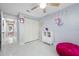 Cute bedroom with spacious closet, fun unicorn decorations, and marble-like tile at 12351 Cloverstone Dr, Tampa, FL 33624