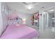 Cozy bedroom featuring a decorative bed with a walk-in closet at 12351 Cloverstone Dr, Tampa, FL 33624