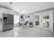 Bright breakfast nook featuring modern seating and a view of the backyard patio at 12351 Cloverstone Dr, Tampa, FL 33624