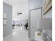 Bright hallway with a view to an open-concept dining and living area at 12351 Cloverstone Dr, Tampa, FL 33624