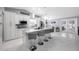 Bright and spacious kitchen with island, stainless steel appliances, eat-in dining, and backyard access at 12351 Cloverstone Dr, Tampa, FL 33624