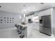Modern kitchen with stainless steel appliances and an island perfect for entertaining at 12351 Cloverstone Dr, Tampa, FL 33624