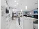 Beautiful white kitchen, marble countertops, stainless appliances, eat in kitchen, and open concept living at 12351 Cloverstone Dr, Tampa, FL 33624
