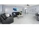 Spacious living room featuring sleek tile flooring, modern furnishings and decor at 12351 Cloverstone Dr, Tampa, FL 33624