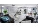 Expansive living and kitchen spaces offer sleek flooring and an abundance of natural light at 12351 Cloverstone Dr, Tampa, FL 33624