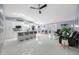 A wide view of the combined kitchen and living spaces and their modern design at 12351 Cloverstone Dr, Tampa, FL 33624