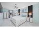 Light and airy primary bedroom with modern decor, en-suite bathroom, and updated fixtures at 12351 Cloverstone Dr, Tampa, FL 33624