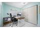 Bright office features a large desk, storage, and white walls for a productive workspace at 12351 Cloverstone Dr, Tampa, FL 33624
