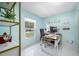 Well-lit home office with large window, white walls and spacious desk area at 12351 Cloverstone Dr, Tampa, FL 33624