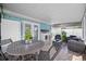 Outdoor living featuring patio furniture, a sink, and string lights at 12351 Cloverstone Dr, Tampa, FL 33624