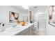 Bathroom with double sinks, shower with glass door, and contemporary decor at 14048 Textile Run, Parrish, FL 34219