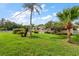 Well-maintained single-story home with a landscaped lawn and a charming covered entrance at 1453 Belleair Rd, Clearwater, FL 33756