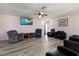 Inviting living room with comfortable seating, ceiling fan, and a TV for relaxation at 1453 Belleair Rd, Clearwater, FL 33756