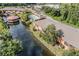 Aerial view of community featuring townhomes, pond, pool, and landscaping at 14625 Par Club Cir # 14625, Tampa, FL 33618