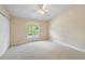 Comfortable bedroom with a large window providing natural light and a spacious closet at 14625 Par Club Cir # 14625, Tampa, FL 33618