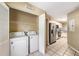 Laundry area including washer and dryer, conveniently located near the kitchen at 14625 Par Club Cir # 14625, Tampa, FL 33618