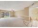 Open living area with sliding glass doors offering water views and a ceiling fan at 14625 Par Club Cir # 14625, Tampa, FL 33618
