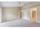 Spacious primary bedroom with plush carpeting, a vaulted ceiling, and an ensuite bathroom at 14625 Par Club Cir # 14625, Tampa, FL 33618