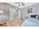 Cozy bedroom featuring a ceiling fan, soothing gray walls, and a comfortable single bed at 18164 Turning Leaf Cir, Land O Lakes, FL 34638