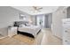 Serene bedroom with a queen bed, soft carpet, and a large window with natural light at 18164 Turning Leaf Cir, Land O Lakes, FL 34638