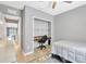 Neutral bedroom with built-in desk area, ceiling fan and view of the lake at 18164 Turning Leaf Cir, Land O Lakes, FL 34638