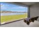 Relaxing covered patio featuring a swing with scenic views of the lake and neighborhood at 18164 Turning Leaf Cir, Land O Lakes, FL 34638