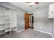 Bedroom featuring gray walls, carpeted floor, ceiling fan, and closet at 2612 Lenna Ave, Seffner, FL 33584