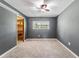 Clean bedroom with window views and an attached shelved closet at 2612 Lenna Ave, Seffner, FL 33584