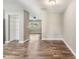 A view of the dining room and the living room with consistent flooring and wall colors at 2612 Lenna Ave, Seffner, FL 33584
