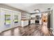 Updated kitchen featuring stainless appliances, beautiful butcher block counters, and glass doors to backyard at 2612 Lenna Ave, Seffner, FL 33584