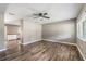 Living room with wood floors and gray walls, open to the kitchen area at 2612 Lenna Ave, Seffner, FL 33584