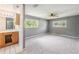 Bright main bedroom with ensuite bathroom, ceiling fan, and large windows with views at 2612 Lenna Ave, Seffner, FL 33584