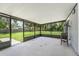 Spacious screened-in patio offering seamless indoor-outdoor living and views of the backyard at 2612 Lenna Ave, Seffner, FL 33584